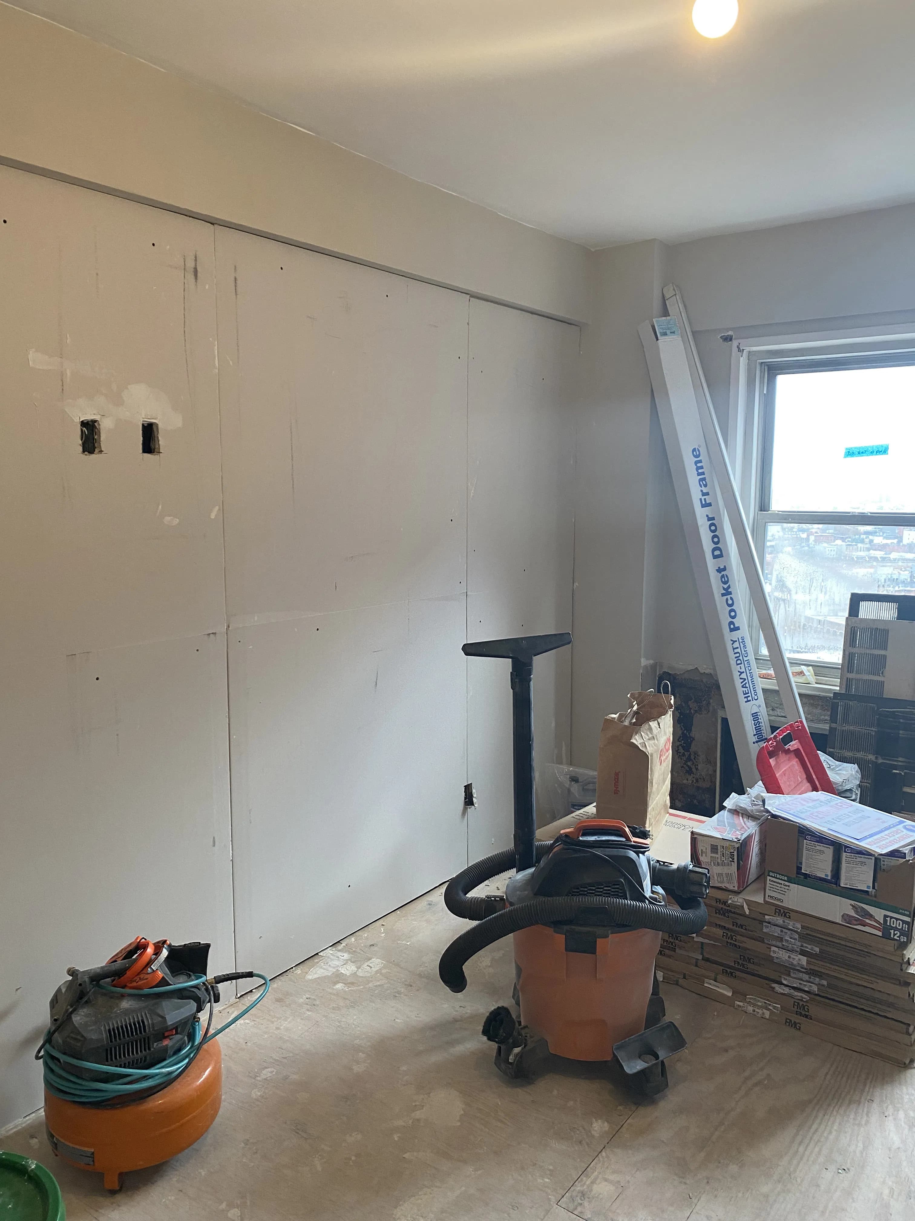 Apartment remodel featuring fresh paint and wall preparation work